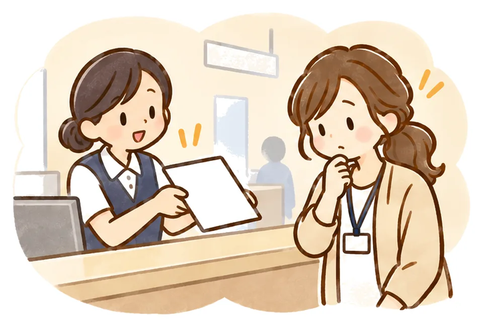 病院の受付で空欄の書類を差し出され、ケアマネが首をかしげて考えている