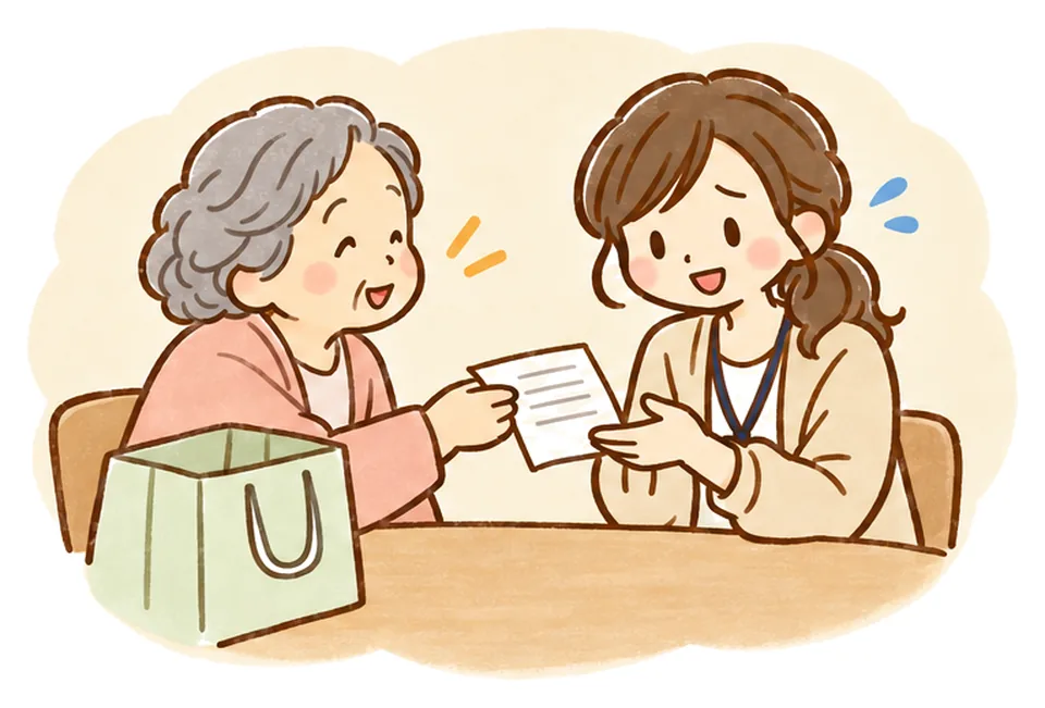おばあさんが買い物のメモを差し出し、ケアマネが困った笑顔をしている