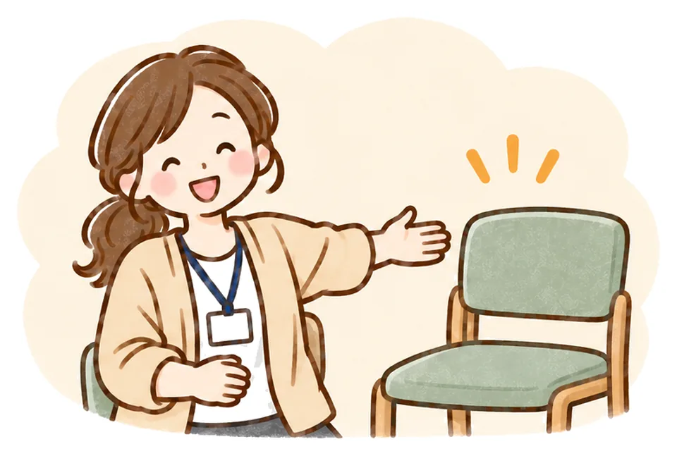 ケアマネが隣の空いているいすをやさしくすすめている